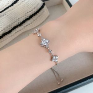 Light luxury zircon hollow flower geometric pull-out bracelet real gold electroplating simple niche temperament high-end jewelry women