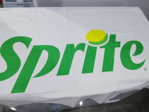Sprite branded Towel with green logo and yellow lemon slice.