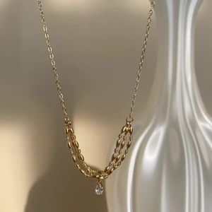 Niche luxury high-end smiley rice-shaped zirconia twisted necklace collarbone chain 18K Gold