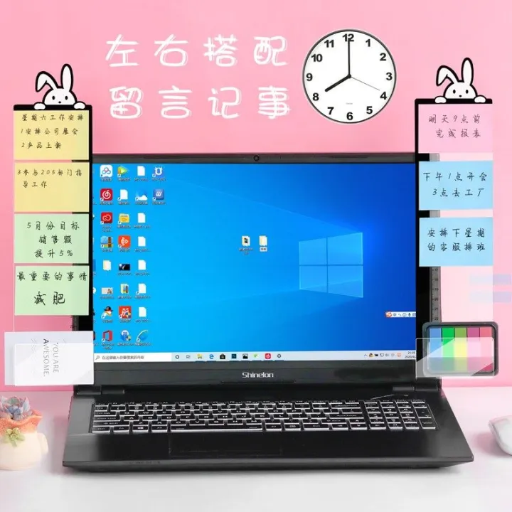 The side of the message board next to the computer is clamped with ...