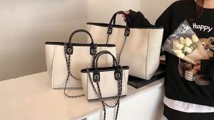AE2025 Túi xách kiểu xô phong cách châu Âu và Mỹ mới dành cho nữ dung tích lớn có thể xách tay đeo vai đeo chéo túi tote có dây xích hợp thời trang.