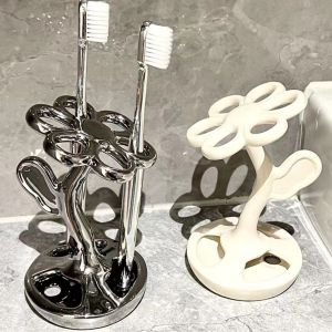 JITEN รูปทรงดอกไม้ ที่ใส่แปรงสีฟันเซรามิก การประหยัดพื้นที่ ช่องเสียบ6ช่อง ชั้นจัดเก็บแปรงสีฟัน ง่ายต่อการทำความสะอาด กันลื่น ชั้นวางแปรงแต่งหน้า อุปกรณ์เสริมในห้องน้ำ