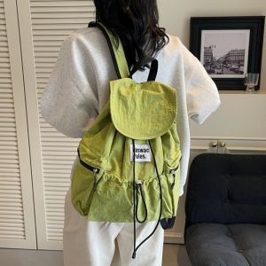 PUREGLOW สีพื้น กระเป๋าเป้แบบมีเชือกรูด น้ำหนักเบา ไนลอน กระเป๋าสะพายไหล่แบบมีรอยพับ แฟชั่น ความจุขนาดใหญ่ กระเป๋านักเรียน กลางแจ้ง