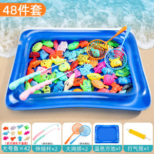 Blue inflatable fish pool with colorful magnetic fish toys. Child playing in pool with glowing fish. Magnetic attraction causes fish to light up.