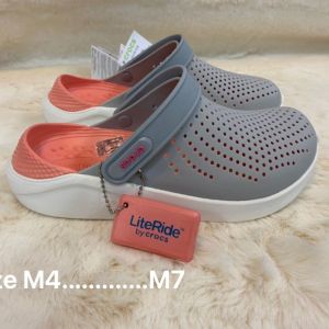 Crocs LiteRide Clog in gray/orange for women. Beautiful shoes good quality durable fashionable and popular. Perfect for beach trips/swimming. Light soft comfortable and pain-relieving.