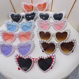 AU Heart-shaped frameless sunglasses with pearl embellishments fashionable for parties and gatherings with a unique and quirky design and in trendy candy colors