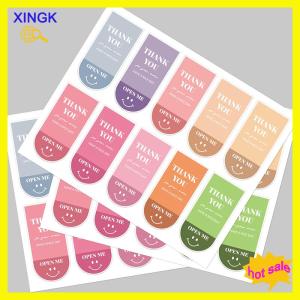 XINGK 100ชิ้น 10แผ่นขอบคุณสำหรับการสั่งซื้อของคุณสติกเกอร์ตกแต่งยิ้มสติกเกอร์ปิดผนึกสำหรับธุรกิจจัดส่งบรรจุภัณฑ์ถุงไปรษณีย์
