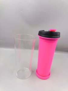 Four colorful travel tumblers with black lids and colored tabs.