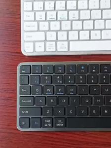 ผู้ผลิตไร้สาย 2.4G คีย์บอร์ดมายากลบลูทูธแบบสองโหมดสำหรับศัพท์มือถือ  magic แท็บเล็ตพีซี คีย์บอร์ดขนาดใหญ่ คีย์แคปสากล Hot