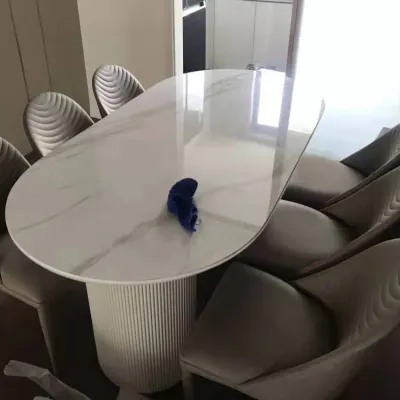 Light luxury rock dining table online celebrity light luxury 2021 new marble oval cylindrical foot dining table.