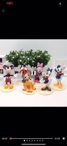 Childrens collection of dolls toys cake decorations games family collection of doll toys