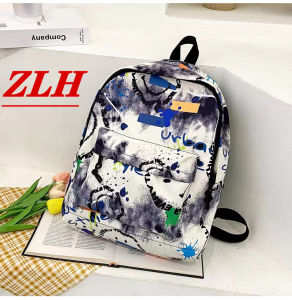 ZLH SHOP-จัดส่งจากกรุงเทพฯ กระเป๋าเป้เด็กผู้หญิงรุ่นใหม่ ลายพรางทันสมัย ​​กระเป๋านักเรียนนักเรียนสุดเก๋ เป้พิมพ์ลายกราฟฟิตี้ มี 4 สีให้