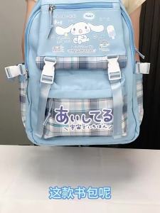 กระเป๋าเป้โรงเรียนประถม Cinnamoroll รุ่นใหม่สำหรับเกรด 3 ถึง 6 ความจุขนาดใหญ่ กระเป๋าสะพายคู่น่ารักสำหรับเด็กผู้หญิง สไตล์อินสตาแกรม กระเป๋าเป้เบา