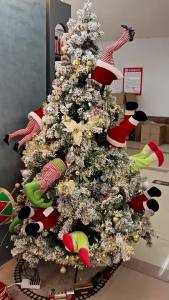 Christmas Animated Kicking Santa Claus and Elf Grinch Legs Kickers Christmas Decorations Gotten Stuck in Christmas Tree