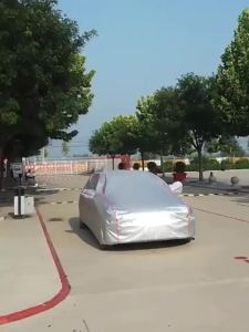 Thickened insulated car cover with aluminum foil lining providing protection against snow sun rain and UV rays full-coverage car cover