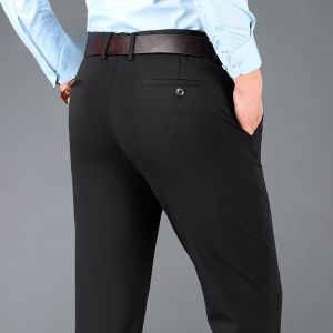 Mens casual loose pants made of stretch fabric suitable for formal occasions. Straight-leg cut perfect for office work. Solid color straight-leg design with stretchy fit no ironing required ideal for business settings.