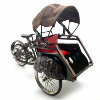 Miniatur becak dari besi ukuran tanggung