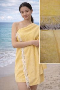 Golden-orange and cream handwoven shawl with textured fabric and fringed edges. Suitable for beach or casual wear.