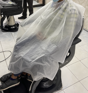 50pcs Disposable Plastic With Neck Cut-out - IN ROLL - Barber/Salon Cape  - Plastic Gunting Rambut