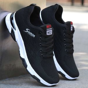 Black mesh sneakers Breathable lace-up closure cushioned heel lightweight casual wear. Outdoor setting.