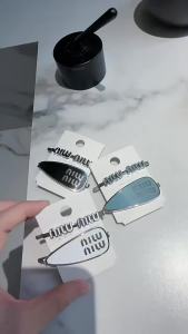 original miumiu Letter-shaped lightweight and stylish hair clips with a water droplet design perfect for holding bangs and side-swept hair high-quality hair accessories