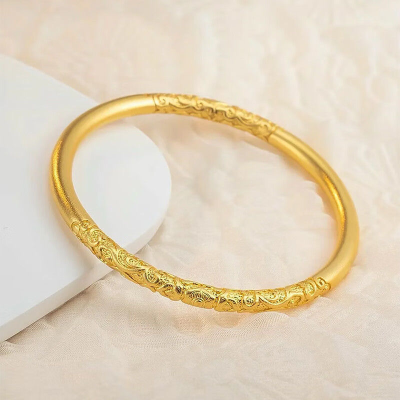 Vintage Gold-Plated Bangle with Traditional Carvings and Elegant Design