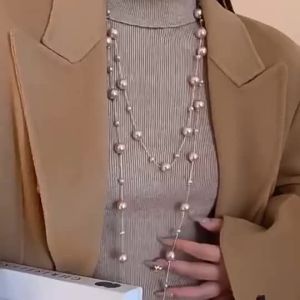 Dây chuyền ngọc trai nhiều lớp thanh lịch dây chuyền áo len phong cách sang trọng nhẹ nhàng mùa thu đông phụ kiện hợp kim đa năng mặt dây chuyền trang phục dây đeo eo. 2026