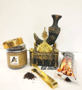 Arabian traditional ceramic burner set is designed for the aromatic practice of burning bakhoor. The set features a beautifully crafted ceramic burner with intricate gold and black designs making it a decorative and functional piece.