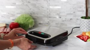 OVENTE Electric Sandwich Maker with Non-Stick Plates Indicator Lights Cool Touch Handle Easy to Clean and Store Perfect for Cooking Breakfast Grilled Cheese Tuna Melts and Snacks Black GPS401B