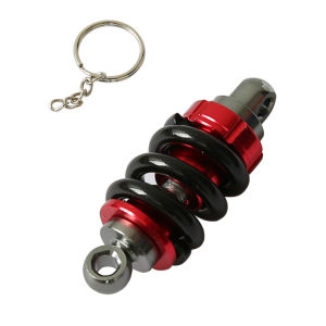 พวงกุญแจตัวโช๊คอัพโลหะ1ชิ้นแฟชั่นสำหรับแต่งมอเตอร์ไซค์พวงกุญแจสุดเท่ห์สำหรับดึงลม