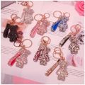 New Cute Bling Rhinestone Cartoon Gloomy Bear Keychain With Strap KAWS Keychain Keyring  Key Ring Chain Doll Pendant Pendant New Rhinestone Violent Bear Keychain Ins Cute Gift Toys Violent Bear Kaws Keychain. 