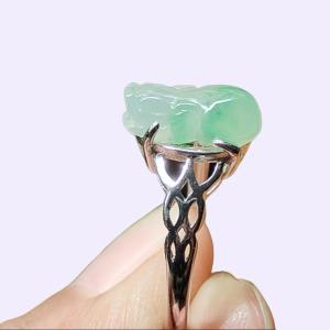 Crafted as Pixiu on Light Green Hue with Light Green Patches Natural Type A Jadeite Jade set with S925 as adjustable ring certificate weighs 2.01 grams measurement 11.8 * 5.5 * 3.8 mm (s925ring27)