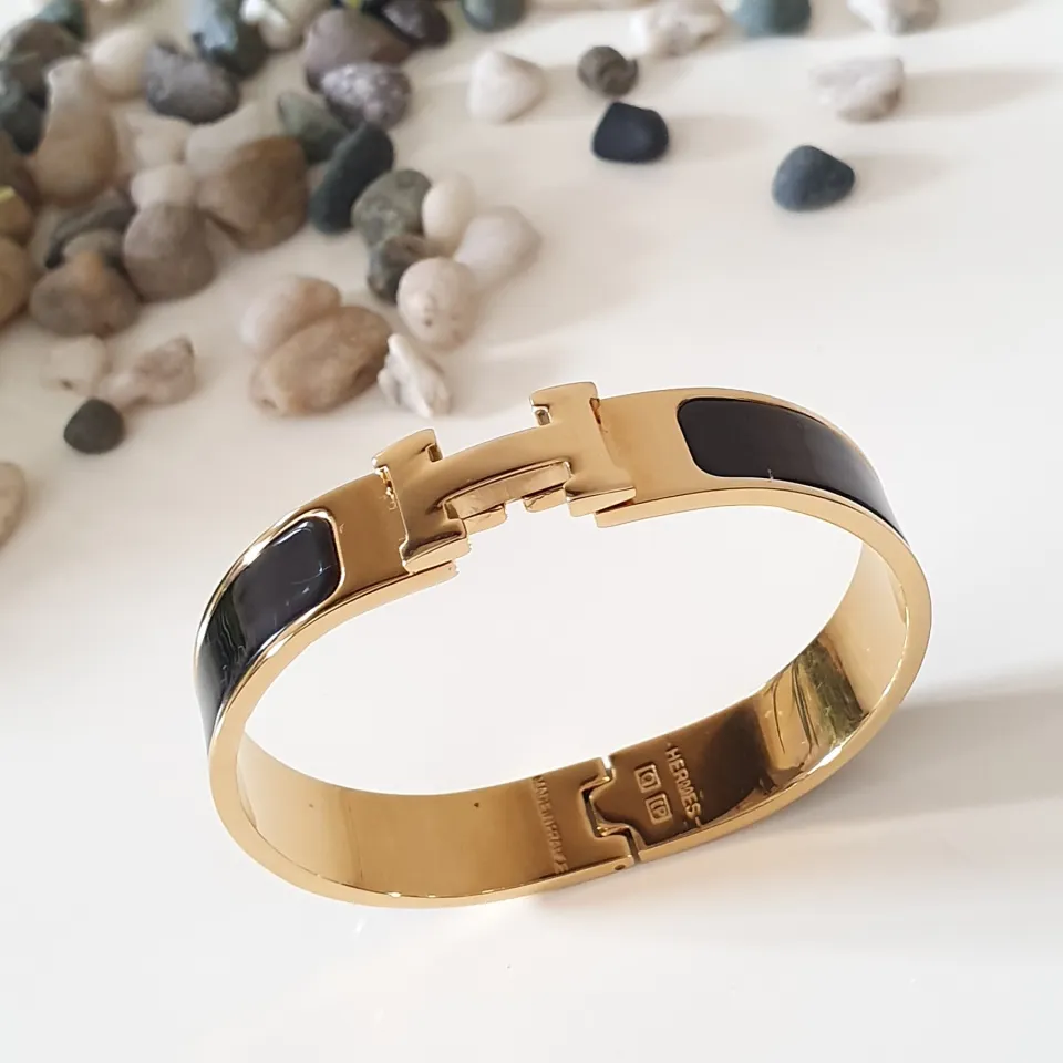 Hermes bangle black deals and gold