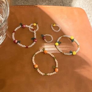 VÒNG TAY PHA LÊ HOA QUẢ THỜI TRANG