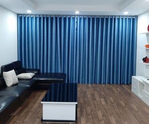 Rèm cửa màu xanh che nắng phòng ngủ cửa sổ