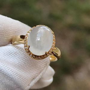 Icy Translucent Premium Quality Natural Type A Jadeite Jade crafted as Oval Cabochon set on 18k gold with diamonds as Ring with certificate weigh 2.54 grams Finger Size 15mm Measurement 9.9 * 8.2 * 4.5 mm (18kring22)
