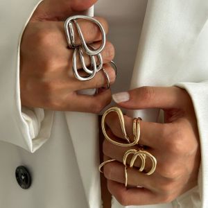 IDEAL ทองเงินเงิน แหวนโลหะแหวน รูปทรงเรขาคณิต พูดเกินจริง แหวนกลวงออก แฟชั่นสำหรับผู้หญิง Twined แหวนนิ้วมือเรียบง่าย สำหรับผู้หญิง