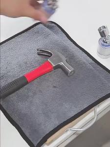 Paul Smith Faucet Water Filter Titanium Strainer ORE Super - Continuous filtration pressure protection anti-bacterial ABS draining valve. Kitchen scene with person washing vegetables.