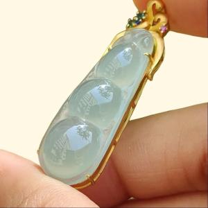 Icy Translucent Premium Quality Natural Type A Jadeite Jade crafted as Bean set on 18k Gold as Pendant certificate weighs 5.31 grams measurement 40.6 * 12 * 8 mm (18kp52)