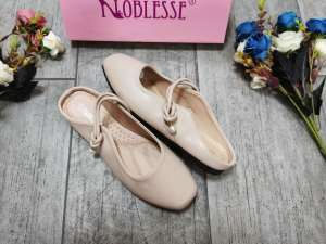 Korean Women wearing soft soled sandals on top of flat toed helf slippers2023