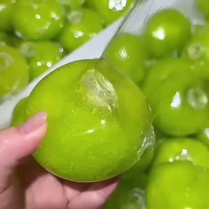 Green Slush Squishy Toy Non-Spring Moldable Fidget Squeeze Ball Crunchy Slush Sound Stress Relief Toy Cooling Sensory Toy for Kids Adults Summer Cute Fruit Decompression
