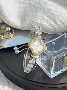 Double Row Exquisite Small Pearl Four-Leaf Clover Drawstring Style Quartz Womens Watch with Inlaid Diamonds Colorful Light Luxury Pull-out Watch