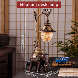 บรรยากาศไม้เนื้อแข็งให้สัมผัสอ่อนนุ่มโคมไฟตั้งโต๊ะช้างจริงสร้างสรรค์บุคลิกภาพห้องนอนลมเอเชียตะวันออกเฉียงใต้โคมไฟหัวเตียง