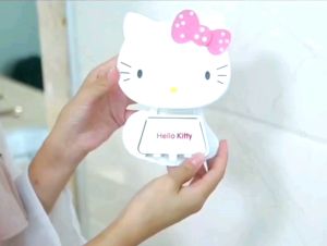 Hello Kitty toothbrush holder and toothpaste squeezer dispenser wall attached with adhesive