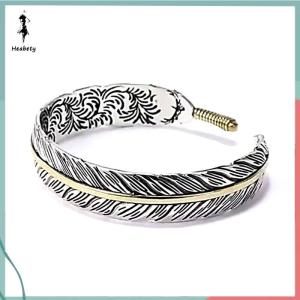 ส่วนลด 10 บาท สำหรับการซื้อ 1 ชิ้น กำไลข้อมือขนนกแกะสลักลายวินเทจดีไซน์สร้างสรรค์ปรับได้สำหรับผู้ชายและผู้หญิง