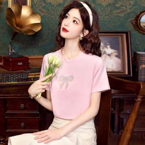 AMMIN 2024เสื้อคอกลมแขนสั้นสำหรับผู้หญิงเสื้อเสื้อยืดผ้าฝ้ายสตรีสีทึบเสื้อสง่างามแบบลำลองติดโบว์ติดเพชรสดใสพิมพ์ลายร้อนแรง