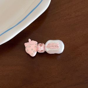 Sweet and adorable strawberry bow hair clips perfect for a feminine style adorned with rhinestones. New 2026 model of duckbill hair clips for the front of the hair.