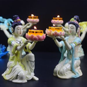 Offering to the Buddha paying respects to the fairy lighting the incense burner the lotus-shaped wax oil lamp stand the flying fairy lamp frame the lotus-shaped lamp base the wax candle stand