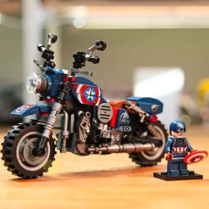 Captain America themed block motorcycle toy with star emblem and chrome details. Bricks minifigure with shield stands beside it.