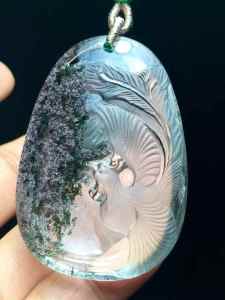 Natural green ghost phoenix pendant. The crystal is clear and the color is emerald green. The phoenix is regarded as the king of all birds and is a symbol of good luck happiness peace prosperity and flourishing.